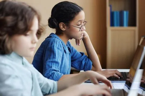 School children working on computers in class Stock Photos
