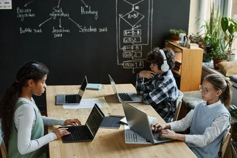 School children working with interface on computers Stock Photos