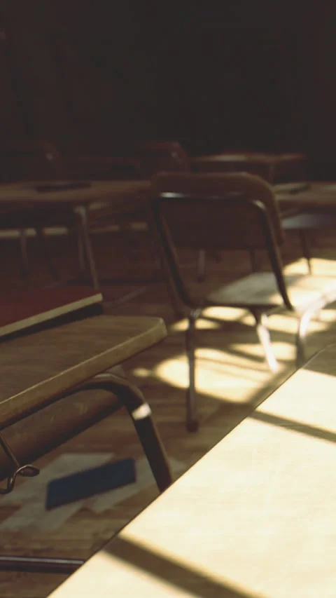 School classroom with empty chairs and sunlight on the floor in afternoon Stock Footage 335097782