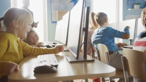 School Computer Science Classroom: Group of Smart Schoolchildren Have Fun Stock Footage 119360164