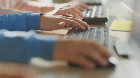 School Computer Science Classroom: Smart Little Schoolchildren Working on PC Stock Footage 119359493