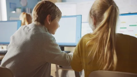 School Computer Science Classroom: Smart Girl and Boy Talking While Using PC 스톡 동영상 119360255