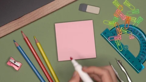 School concept. Womans hand writing grade C, satisfactory mark on notepad Stock Footage 99035015