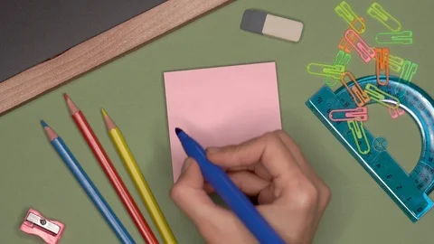 School concept. Womans hand writing DECEMBER on notepad Video stock 99733237
