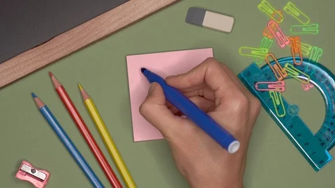 School concept. Womans hand writing HAPPY NEW YEAR on notepad Video stock 99779923