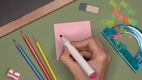 School concept. Womans hand writing SALE on notepad Video stock 99783541