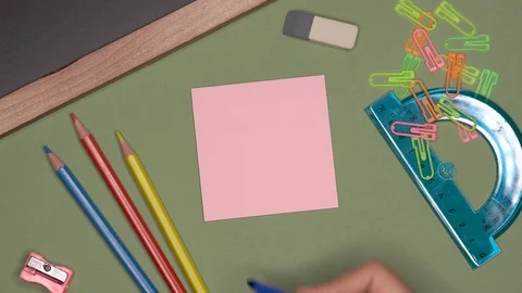 School concept. Womans hand writing PLAN on notepad Stock Footage 99972400