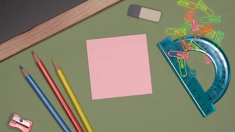 School concept. Womans hand writing BACK TO SCHOOL on notepad Stock Footage 99973473