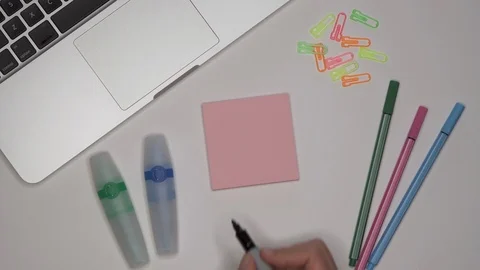 School concept. Womans hand writing LESSON 1 on notepad Stock Footage 100113625