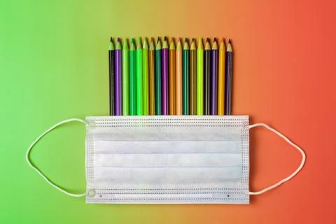 School creative concept in context of pandemic Covid-19. Color pencils and Stock Photos