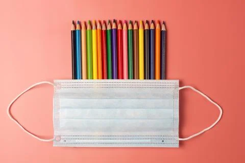 School creative concept in context of pandemic Covid-19. Color pencils and Stock Photos