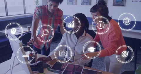In school, diverse team collaborating at desk with animation overlaying work Stock Footage 303608187