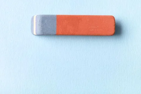 School eraser on blue background Stock Photos