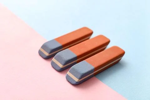 School erasers on color background Stock Photos