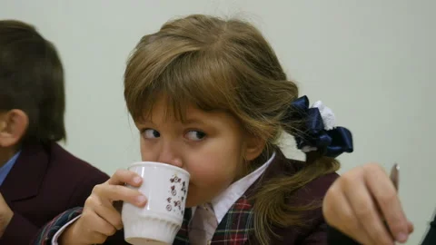 School food - a group of elementary school kids eating a school breakfast Stock-Footage 88334873