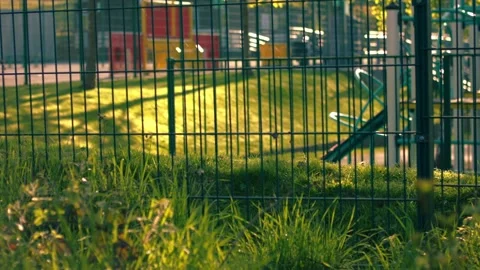 School gates with playground at dusk Stock Footage 335219131
