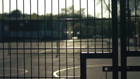 School gates with playground at dusk Stock Footage 336954826