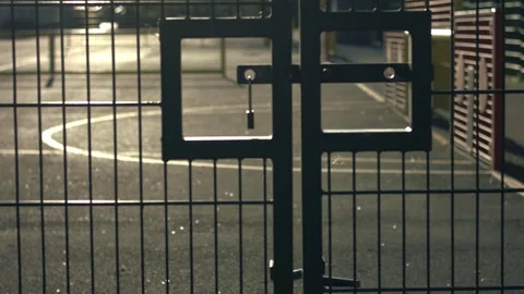 School gates with playground at dusk Stock Footage 345910882