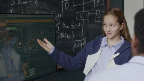 School Girl Discussing Software Development with Teacher in Class Stock Footage 284429262