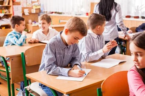 School girl explaining her classmate Stock Photos