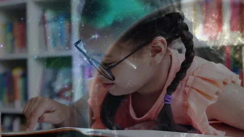 School girl reading book in library, visualizing cosmos with stars, nebulae and Stock Footage 314790889