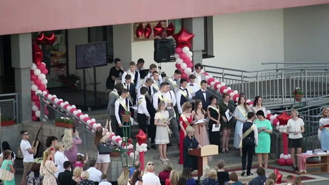 School Graduation Celebration. Presentation of certificates on the site in fr Stock Footage 132413932