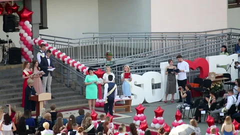 School Graduation Celebration. Presentation of certificates on the site in fr Stock Footage 132414046