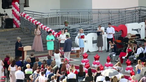 School Graduation Celebration. Presentation of certificates to graduates and  Stock Footage 132414215