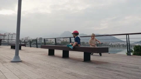 School kid boy, brother teaching happy litttle child cycling and having fun with Vídeos de archivo 228465982