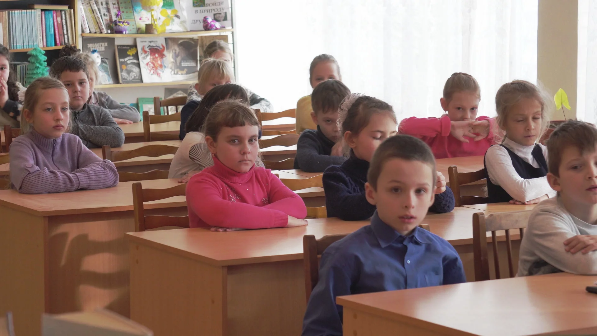 Pupils sit at their desks in a classroom at a public school on  Zamarstynowska Street in