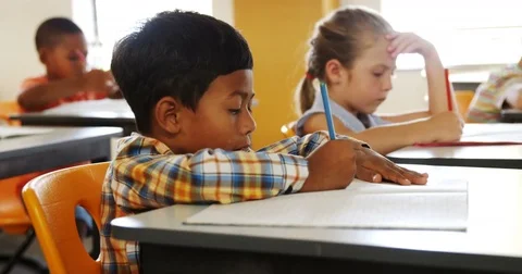 School kids studying in classroom Stock-Footage 70567301