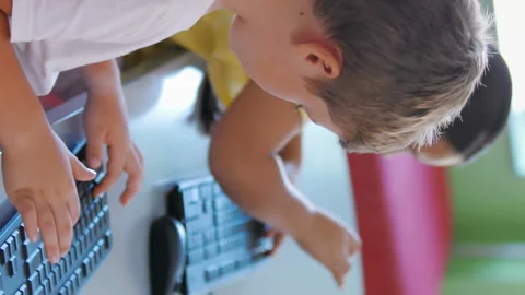 School kids using computer in classroom Stock Footage 301271385