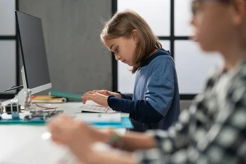 School kids using computer in classroom at school Foto stock