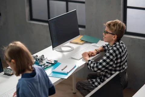 School kids using computer in classroom at school 写真素材