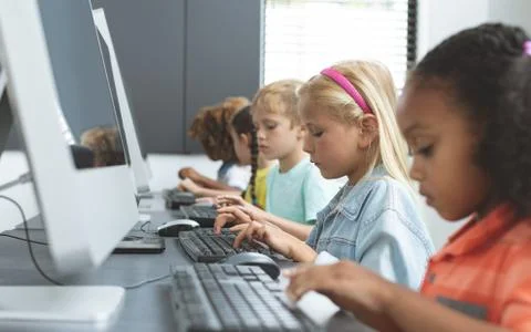 School kids using computer in school 写真素材