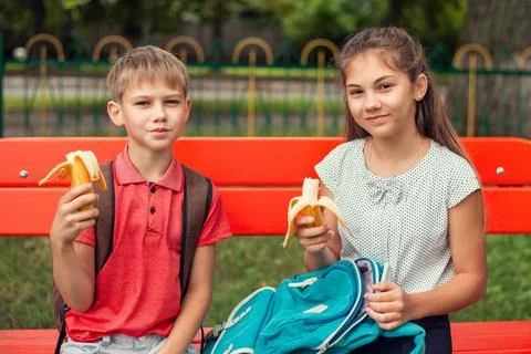 School learners have lunch outdoors Stock Photos