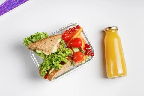 School lunch in box, container isolated on white background. Toasts, sandwi.. Stock Photos