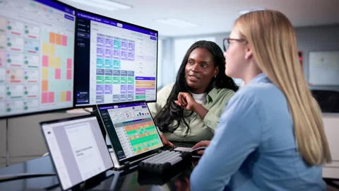 School Manager Reviewing Student Attendance Data On Laptop Stock Footage 345323636