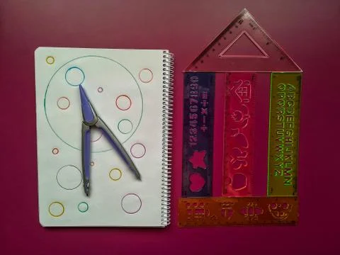 School material in composition on purple background Foto stock