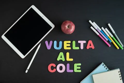 School materials with the phrase REGRESO A CLASE in Spanish. Copy space. Stock Photos