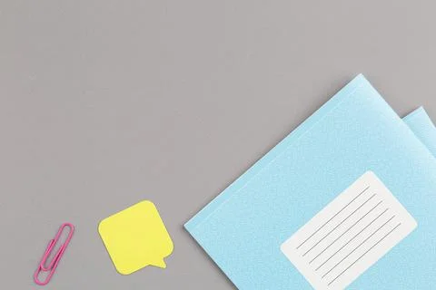 School notebook on grey background. Stock Photos