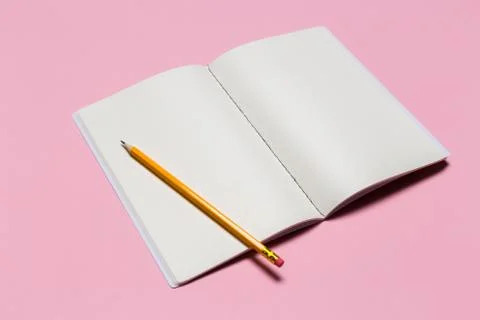 School notebook on a pink background, notepad on a table.Top view Stock Photos