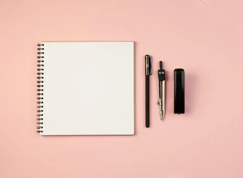 School notebook with white sheets for records on a pink background. Stock Photos