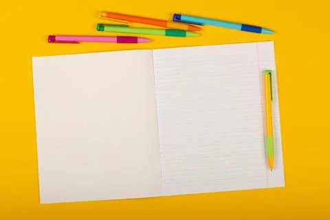 School notebook on a yellow background with copy space for text Stock Photos