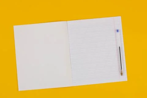 School notebook on a yellow background with copy space for text Stock Photos