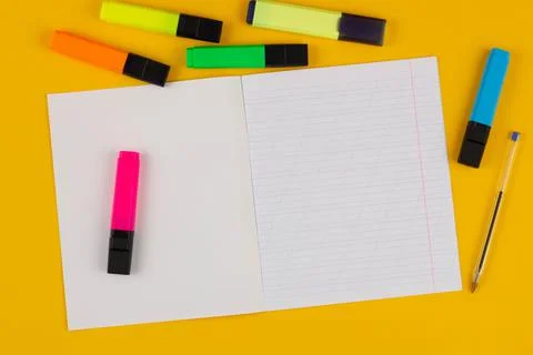 School notebook on a yellow background with copy space for text, colorful Stock Photos