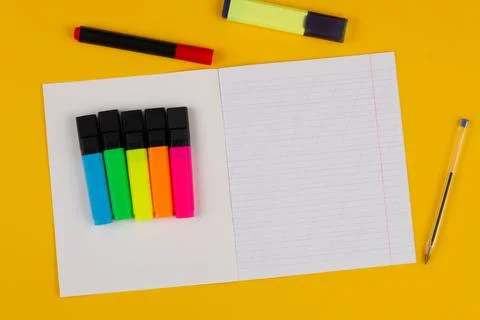 School notebook on a yellow background with copy space for text, colorful Stock Photos