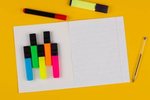 School notebook on a yellow background with copy space for text, colorful Stock Photos