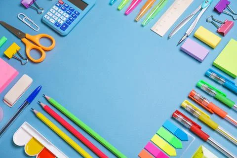 School objects, office supplies, tools and accessories isolated on blue Stock Photos