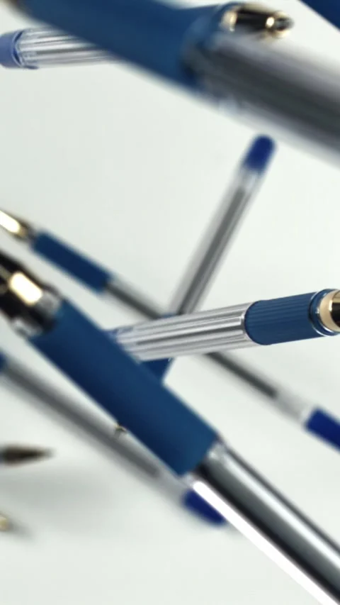 School pens fly up and down. Filmed on a high-speed camera at 1000 fps Stock Footage 335371878